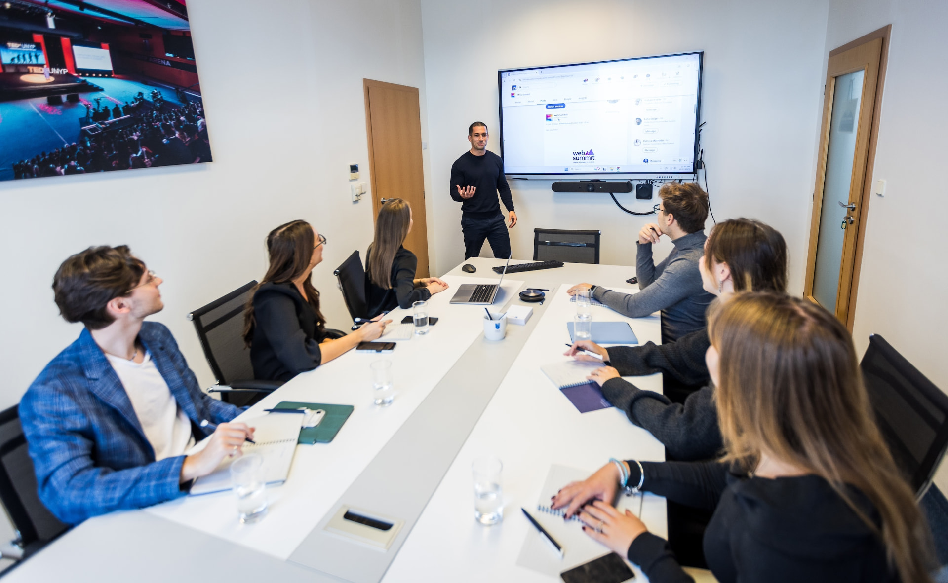 Amit Grinvald leading a strategy session with a team in a boardroom