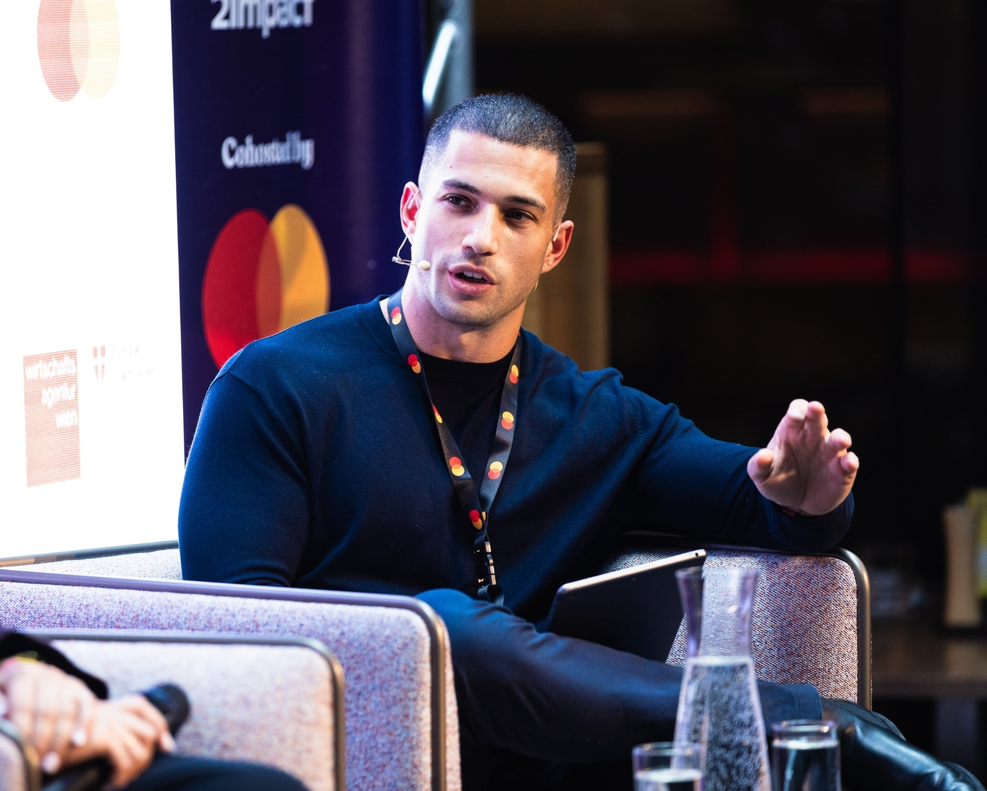 Amit Grinvald speaking on a panel at a business summit in Vienna